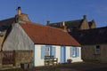 A well tended Traditional Fishing Cottage, now a Holiday home in a small street facing the Harbour