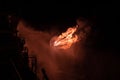 Well testing operation flaring of an oil and gas drilling rig. Burning huge gas flame controlled by the deluge system Royalty Free Stock Photo