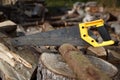 Well used hand-saw cutting wood