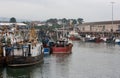 Well used and worn trawlers moored in the busy fishing port of Kilkeel in County Dow Ireland Royalty Free Stock Photo