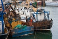 Well used and worn trawlers moored in the busy fishing port of Kilkeel in County Down Ireland Royalty Free Stock Photo