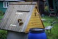 Well and water barrel in the Russian village.