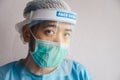 Portrait of Doctor having tired from work while wearing PPE suit for protect coronavirus disease. Royalty Free Stock Photo