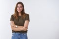 Wellbeing people lifestyle concept. Charming feminine tender outgoing young woman wearing olive t-shirt cross arms chest
