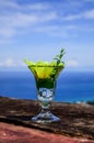 wellcome drink : Cold water and yellow flower in clear glass on blue sky background