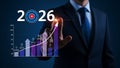 Reaching goals for 2026 business growth with data chart and businessman pointing up Royalty Free Stock Photo