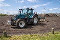 Wellerloi, Limburg, The Netherlands - April 17th, 2021: Heavy duty wheeled tractor on an agricultural field