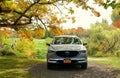 Wellesley Island, New York, U.S.A - October 25, 2019 - A silver Mazda CX-5 SUV surrounded by fall foliage