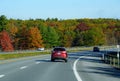 Wellesley Island, New York, U.S.A - October 26, 2019 - The traffic on the highway overlooking the stunning colors of the fall