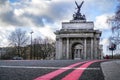 Wellington Arch or Constitution Arch is a triumphal arch located to the south of Hyde Park in London. Dramatic cloudy Royalty Free Stock Photo