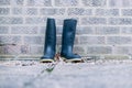 wellington boots on brick wall Royalty Free Stock Photo
