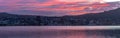 Wellington, New Zealand, Panorama colorful sunset over calm harbor. Royalty Free Stock Photo