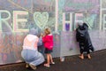 Peaceful Protestors decorate the wall of the Beehive