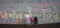 Peaceful Protestors decorate the wall of the Beehive