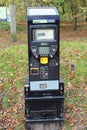 WELLINGTON, SOMERSET, ENGLAND - NOVEMBER 3RD 2022: The National Trust ticket machine stands at the exit to the car park and by the