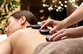 Close up of woman having hot stone massage at spa Royalty Free Stock Photo