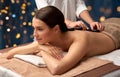 beautiful woman having hot stone massage at spa Royalty Free Stock Photo