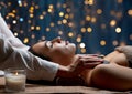 close up of woman having hot stone massage at spa Royalty Free Stock Photo