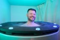 Wellness center patient enjoying whole body cryotherapy session Royalty Free Stock Photo