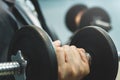 Wellness, healthy concepts. Businessman lifting dumbbell at office. Royalty Free Stock Photo