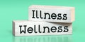 Wellness, illness - words on wooden blocks Royalty Free Stock Photo