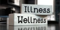 Wellness, illness - words on wooden blocks Royalty Free Stock Photo