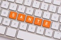 Wellness in orange on white keyboard Royalty Free Stock Photo