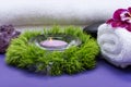 Wellness Relax concept with Spa elements. White Towels, Basalt Stones, Lavender Tea Light Candle, Dianthus Flowers and Amethyst Royalty Free Stock Photo