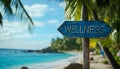 Wellness sign board arrow on beach with sunshine background Royalty Free Stock Photo