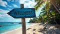 Wellness sign board arrow on beach with sunshine background Royalty Free Stock Photo