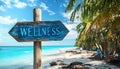Wellness sign board arrow on beach with sunshine background Royalty Free Stock Photo