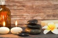 Wellness and spa composition candles with massage stones Royalty Free Stock Photo