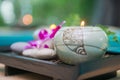 Wellness and spa concept with candles and orchid Royalty Free Stock Photo