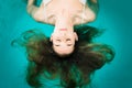 Wellness - young woman floating in Spa