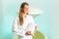 Wellness - young woman floating in Spa in Tank