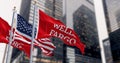 Wells Fargo bank and the United States flags waving in a financial district