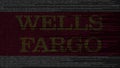 Wells Fargo logo made of source code on computer screen. Editorial 3D rendering
