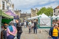 Wells saturday market busy with shoppers in Market Place, Wells, Somerset, UK