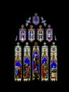 WELLS, SOMERSET, ENGLAND - MARCH 16 2020: Stained glass window in the Parish Church of St, Saint Cuthbert. Religious art Royalty Free Stock Photo
