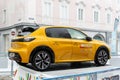 Wels, Austria - January 12th, 2020: Newest Peugeot 208 gt-line 2020 model stand on basement among public skating rink in center