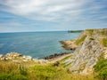 Rocky headland and cliffs on the Welsh coastline captured from the Welsh coastal path Royalty Free Stock Photo