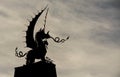 Welsh Dragon statue in Silhouette, against a wintry sky Royalty Free Stock Photo
