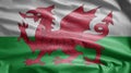 Welsh flag waving in the wind. Close up of Wales banner blowing soft silk Royalty Free Stock Photo