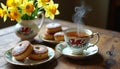 Welsh tea time with traditional cakes and daffodils on a rustic table Royalty Free Stock Photo