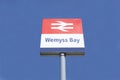 Wemyss Bay railway train station sign against blue sky background Royalty Free Stock Photo