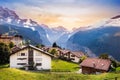 Wengen town in Switzerland at sunset. View over Swiss Alps near Lauterbrunnen valley. Typical Swiss houses in Wengen Royalty Free Stock Photo
