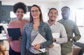 Were all included in the reach for success. Portrait of a group of confident young businesspeople working in a modern Royalty Free Stock Photo