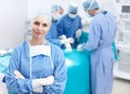 Were the best in the business. Portrait of a happy female surgeon smiling in an operating theatre - Copyspce. Royalty Free Stock Photo