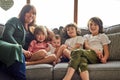 Were a big and blessed happy family. Portrait of a mother bonding with her four little children at home. Royalty Free Stock Photo