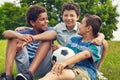 Were a bunch of footie friends. a group of young boys out for a game of soccer in the park.